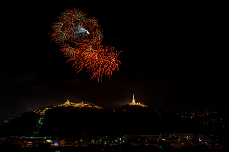 Fireworks at Kao Wang mountain, over the cityscape of Petchburi, Thailandの写真素材