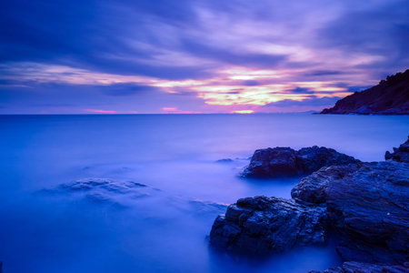 Silky sea and silky clouds during sunset.の写真素材