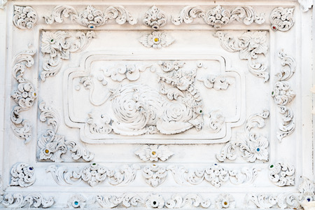 Cement Thai traditional carving art ususlly is decorated in most of Buddhist temple.の写真素材