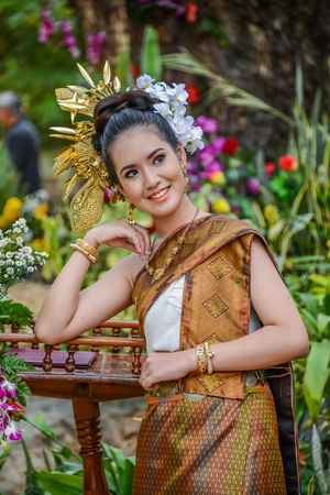 NAKORN PHANOM, THAILAND - FEBRUARY 14, 2015: Thai northeastern Phutai dancer with traditional costume  in Phutai world event day in Renunakorn of Nakorn Phanom, Thailand.のeditorial素材