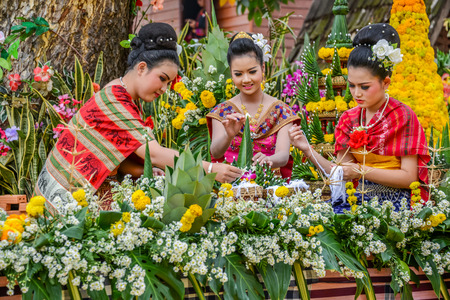 NAKORN PHANOM, THAILAND -  FEBRUARY 14, 2015: Thai northeastern Phutai traditional liftstyle in making rice offering and garland for Phutai world cerebration event in Renunakorn of Nakorn Phanom, Thailand.のeditorial素材