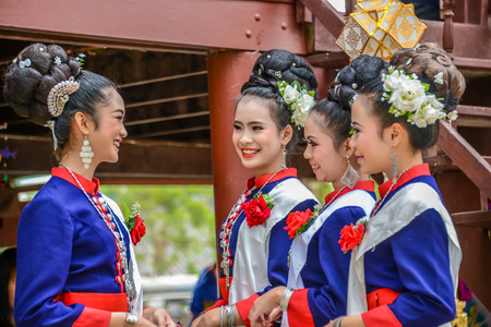 NAKORN PHANOM, THAILAND - FEBRUARY 14, 2015: Thai northeastern Phutai dancers with traditional costume  in Phutai world event day in Renunakorn of Nakorn Phanom, Thailand.のeditorial素材