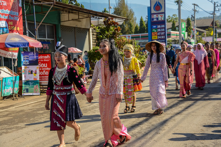CHIANGMAI, THAILAND - JANUARY 25, 2015: Multi indigenous peoples in parade of 22nd Traditional Skirt Fabric and The Indigenous Product and Culture Festival in Mae Chaem, Chiangmai, Thailandのeditorial素材