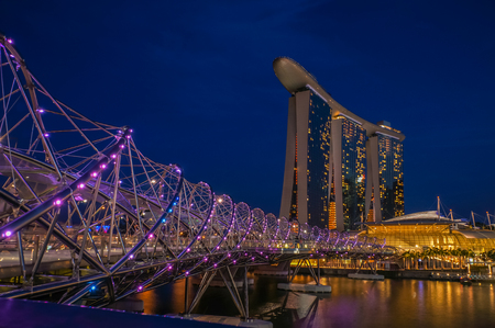 SINGAPORE - JUNE 17, 2014 :  Bridge to Marina Bay Sands Hotel during twilight time in Singaporeのeditorial素材