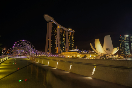 SINGAPORE - JUNE 17, 2014 :  Bridge to Marina Bay Sands Hotel at night in Singaporeのeditorial素材