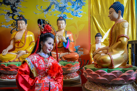 Chachoengsao, Thailand - July 14, 2013 : Beautiful woman with traditional chinese red dress in Chinese shrine in Thailand.のeditorial素材