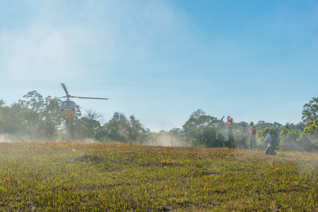 Nakhon Ratchasima, Thailand - December 23, 2017: Helicopter landing to carry injured passenger to hospital in rescue drill on simulation of passenger airplane crashed in Khao Yai, national park of Nakhon Ratchasima, Thailandのeditorial素材