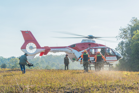 Nakhon Ratchasima, Thailand - December 23, 2017: Rescue team carrying injured passenger to helicopter to hospital in rescue drill on simulation of passenger airplane crashed in Khao Yai, national park of Nakhon Ratchasima, Thailandのeditorial素材