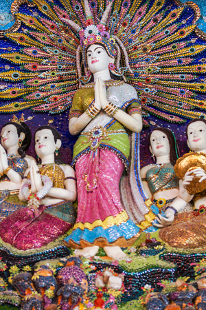 Bangkok, Thailand - July 15, 2015: Thai beautiful literature statues to be decorated on Buddhist church wall at Pariwas temple where is destination of tourists in Bangkok, Thailandのeditorial素材