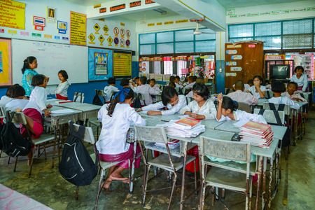 Kanchanaburi, Thailand - July 22, 2016: Mon students with traditional dresses studying in classroom of government school in rural of Kanchanaburi, Thailandのeditorial素材