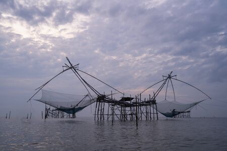 Thai traditional fishing tool make from wood and bamboo installed in swamp or river used in rural of Thailandの写真素材