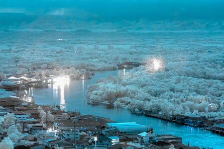 Aerial view of Chumphon city in provincial of Thailand taken from Mutsea view point  in infrared photographyの写真素材