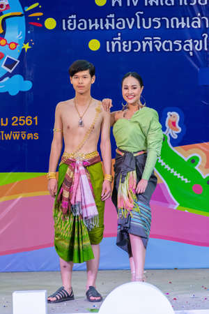 Phichit, Thailand - December 29, 2018: Beautiful girl and smart boy models in collection of Thai traditional costume in the event of promoting tourism open for public in Phichit, Thailandのeditorial素材