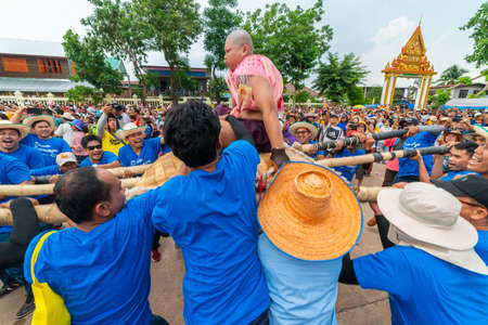 Chaiyaphum, Thailand - May 12, 2019: Parade of ancient pre-ordination of Buddhist which pre-monk on bamboo litter shaken severely before ordination in Buddhsit temple in Chaiyaphum, Thailandのeditorial素材