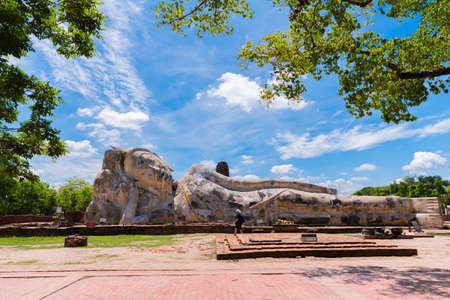 Ayutthaya, Thailand - June 15, 2019: Ancient reclining Buddha Image in Wat Lokaya Suttharam, the travel destination for tourists in Ayutthaya, Thailandのeditorial素材