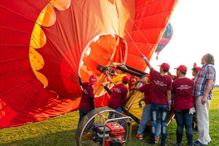 Chiangrai, Thailand - February 15, 2019: Exhibitors preparing balloon to fly in International Balloon Festival 2019 at Singha park in Chiangrai, Thailandのeditorial素材
