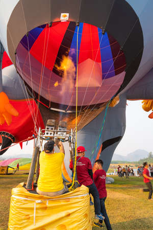 Chiangrai, Thailand - February 15, 2019: Exhibitors preparing balloon to fly in International Balloon Festival 2019 at Singha park in Chiangrai, Thailandのeditorial素材