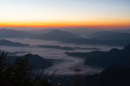 Beautiful view of sunrise sky at Phu Chi Fa in Chiangrai, Thailandの写真素材