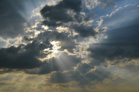 The sun's rays passing through the storm clouds.の写真素材