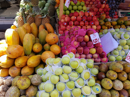 Ripe fruits stacked at a local market of fruit and vegetable in Sri Lankaの写真素材