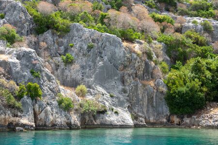 Ruins of sunken ancient city of Dolichiste on the northern part of the Kekova Island. Devastating earthquake in the 2nd century ADの写真素材