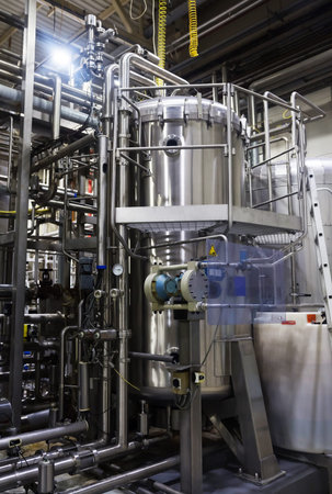 Industrial interior of an alcohol factory with silo