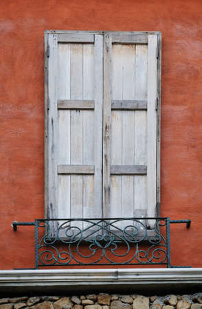 Vintage-style wood window on a colorful painting wallの写真素材