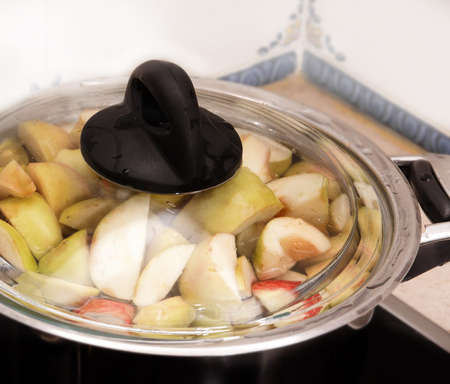 sliced apples in the pot close upの写真素材