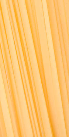 Abstract pasta background - yellow diagonal lines from italian pastaの写真素材