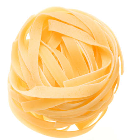 Nest of yellow italian macaroni isolated on white - selective focus on upper front partの写真素材