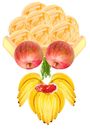 Funny food head made of natural components mostly fruits and veggies - its hair made of italian pasta, its face made of such ingredients as french cheese, green dill, meat chop, bunch of bananasの写真素材