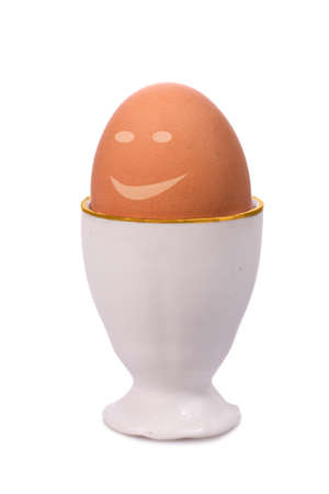 fresh happy egg in eggcupの写真素材