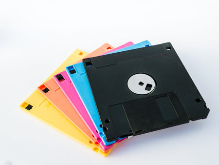 A floppy disk, or diskette, is a disk storage medium composed of a disk of thin and flexible magnetic storage medium, sealed in a rectangular plastic carrier lined with fabric that removes dust particles.の写真素材