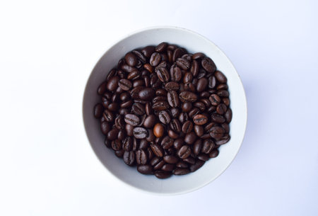 Coffee cup and coffee beans on white background