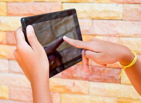 hand using tablet