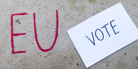 Brexit UK EU referendum concept with word UN and Eng and vote on stone wallの写真素材