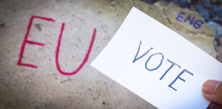 Brexit UK EU referendum concept with word UN and Eng and vote on stone wallの写真素材