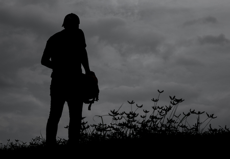 Siluate a man with grassの写真素材