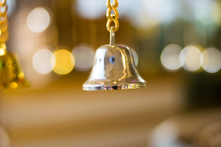 silver bell with bokeh backgroundの写真素材