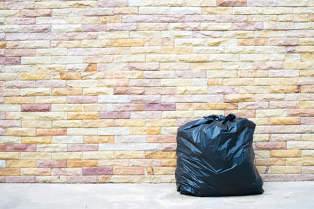 Garbage bag on brick wall background textureの写真素材