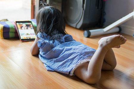 little girl using a tabletの写真素材