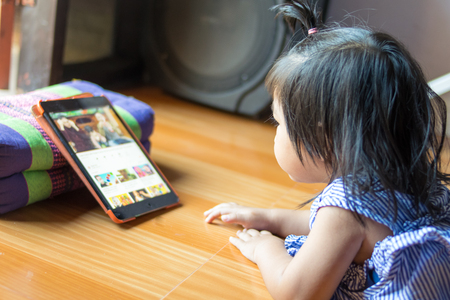 little girl using a tabletの写真素材