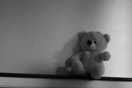 doll bear black and white sitting aloneの写真素材