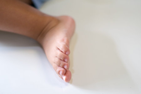 close up child foot on white background