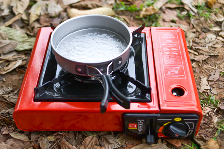 Drink coffee in the forest, Boil water with a gas stove.の写真素材