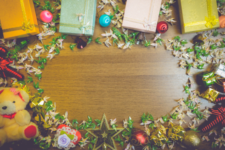 Christmas wooden background with Origami Peacock gift boxes decorations on wooden boardの写真素材
