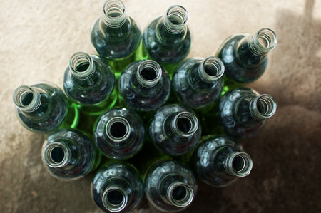 Green glass bottle with water
