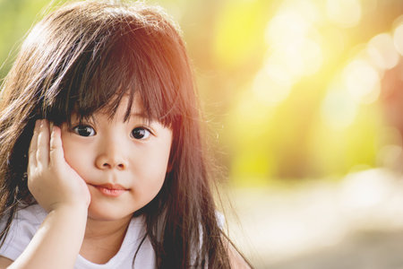Cute Asian baby Smiling in garden.の写真素材