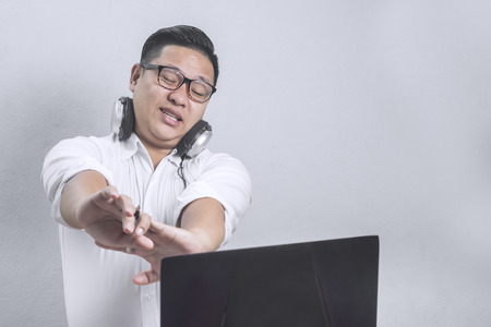 Portrait of an Asian young businessman relaxing from work copy space for text.の写真素材