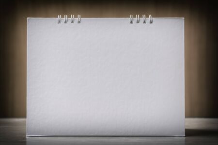 Blank Paper Desk  Calendar on the Wooden Table vintage tone.の写真素材